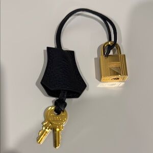 Hermes Black and Gold Bag Charm